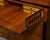 A Biedermeier period walnut butler's chest from the 19th century with drop front desk, ebonized accents and inlaid...