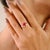 This elegant wave solitaire ring in 14K white gold showcases a 1.14 carat oval cut natural ruby, measuring approximately...