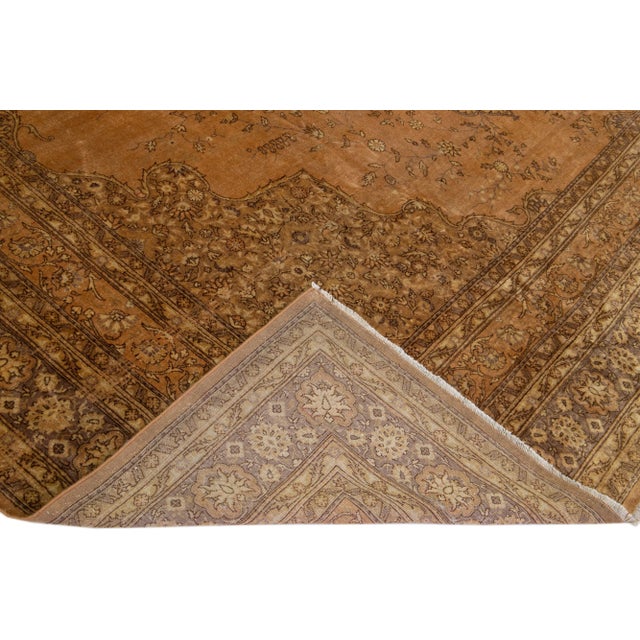 Beautiful Sivas hand-knotted wool rug with a brown field. This piece has a gray-designed frame and accents in a gorgeous...