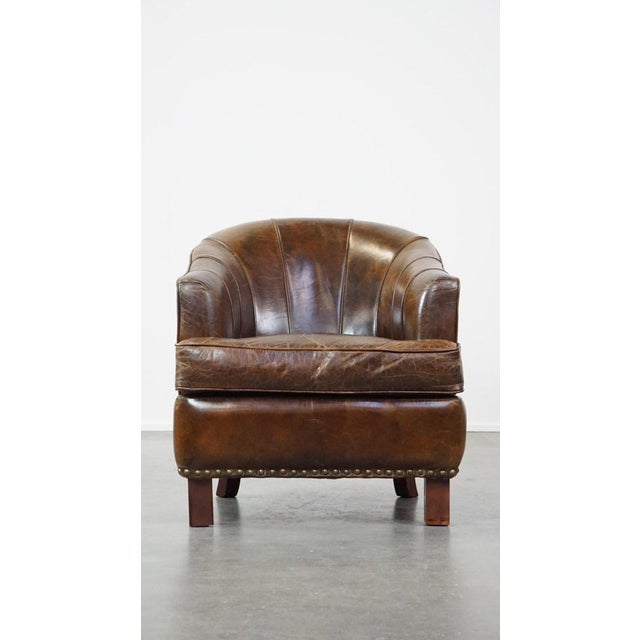 Offered is this stylish armchair made of cowhide leather with a unique design and a beautiful finish. This fantastic...