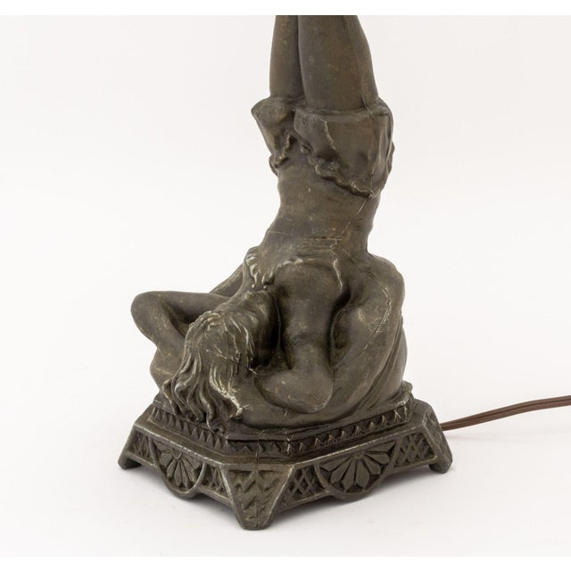 Art Deco Figural Metal Amber Glass Globe Shade Table Lamp. 21.75" H x 5.75" W x 6" D. Provenance: From a New York City...