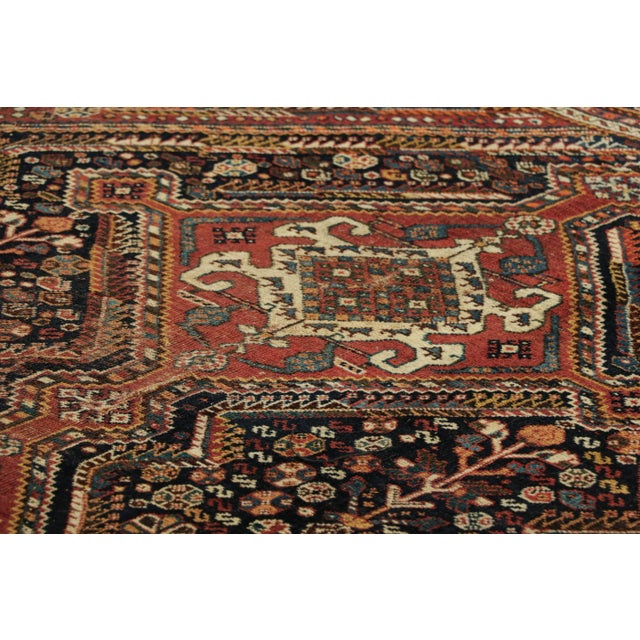 Made with hand-knotted wool circa 1910-1920, this 5x6 antique Persian rug is a Qashqai tribal rug, and an exciting new...