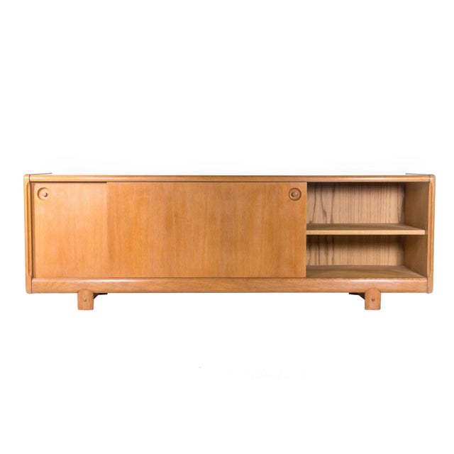 Oak sideboard by H.W. Klein, Norway in the 1960s. Produced by Bramin Møbler. Sliding doors with one adjustable shelf and...