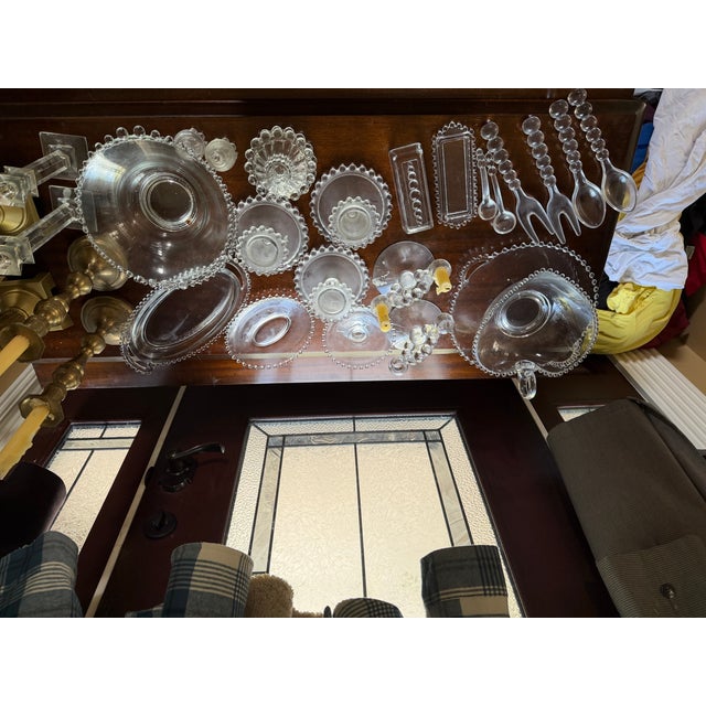 An exceptional vintage bubble glass collection comprising more than 70 matching pieces, thoughtfully assembled for...