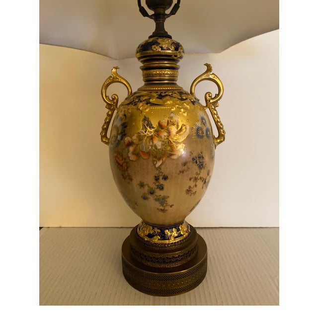 Stunning hand painted and gilt Royal Crown Derby urn now as a lamp. The detailed painted urn with exotic floral decoration...