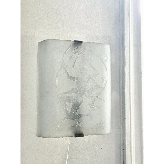 A decorative wall sconce in etched glass and brass holder. Depicting huntress Diana with stag. Swedish modern, 1940s,...
