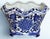 Presenting a blue and white chinoiserie style porcelain cache pot with floral motif and interesting undulating scalloped...