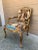 An elegant French Provincial Louis XV style fauteuil showcasing a beautifully carved giltwood frame upholstered in richly...
