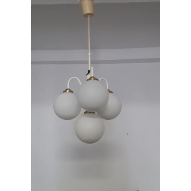 White Vintage Ceiling Lamp with Four White Glass Balls, 1970s, in Very Good conditions. Designed 1970 to 1979 European...