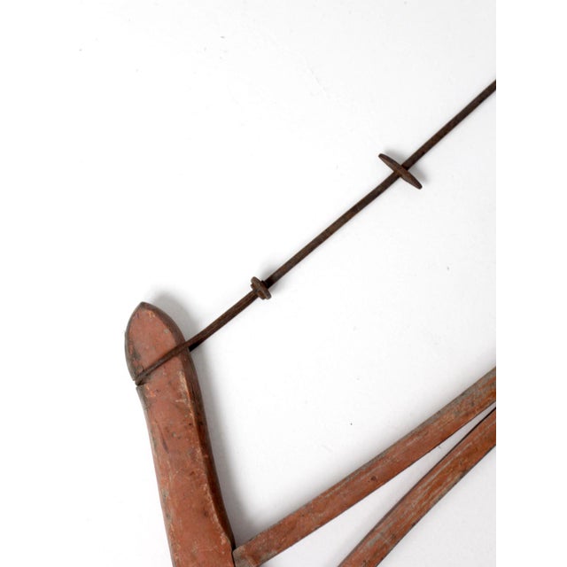 This antique bow saw embodies early American utility in a sculptural, pared-back form shaped by time and use. The...