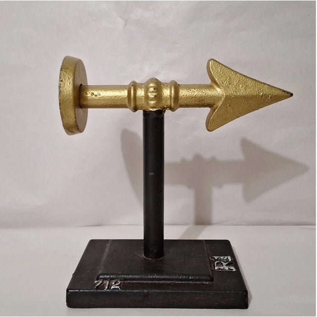 Add a bold, classic touch to your space with this pair of vintage metal arrow bookends. Crafted from solid cast iron and...