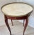 Just in, this charming French Wood Marquetry gueridon side table with a Brass Gallery and original White Marble Top, Early...