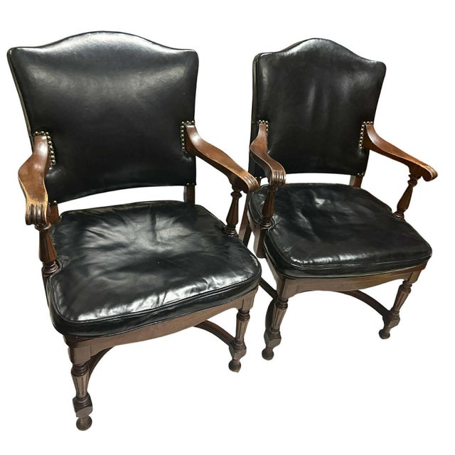 These chairs are remarkable. The glossy black leather is in extraordinarily good condition. Sturdy and quite heavy....