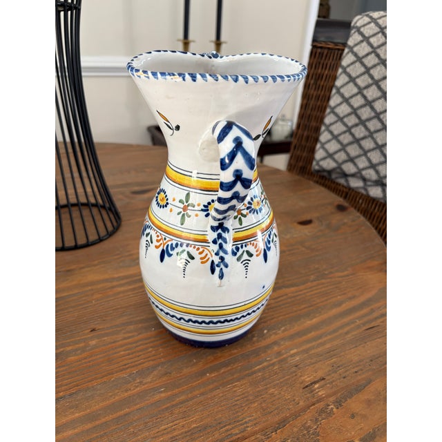 A beautiful vintage hand-painted faience pitcher from Talavera de la Reina, Spain, one of the country’s most celebrated...