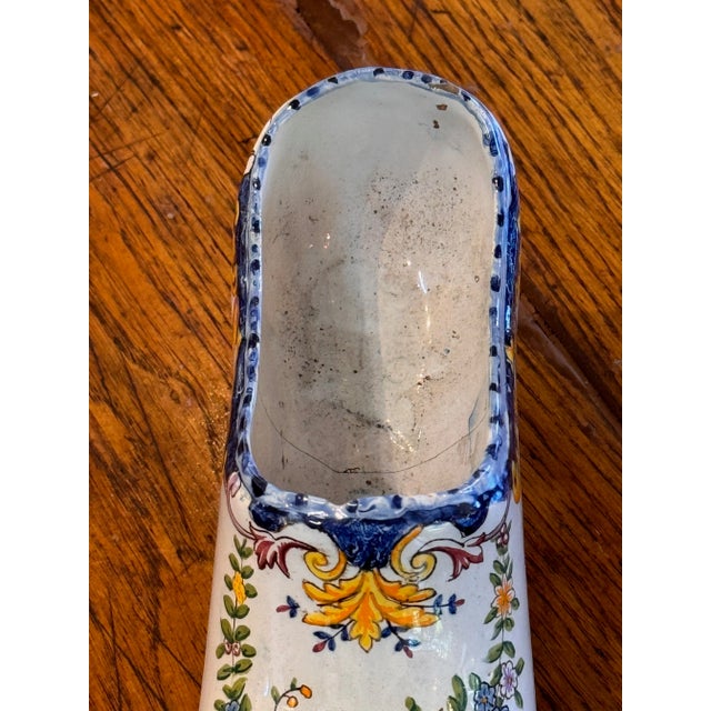 For the shoe collector. A single decorated ceramic shoe.