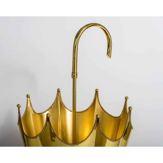 Just in, This Hollywood Regency Polished Brass Umbrella-Shaped Stand. This sculptural entry piece is meticulously designed...