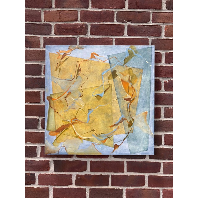 This artwork features an interplay of translucent shapes in warm yellows and cool blues, creating a dynamic sense of...