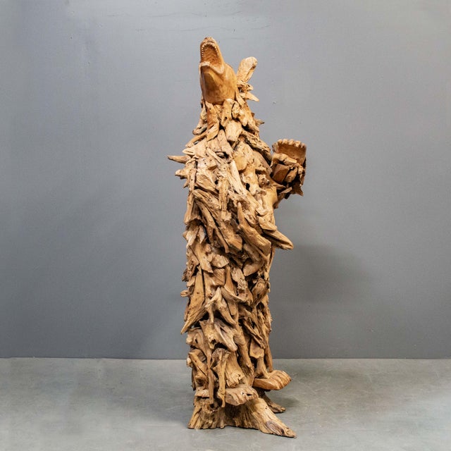 Crafted with a keen eye for detail, this tall bear sculpture was hand crafted from reclaimed teak root in Indonesia and...