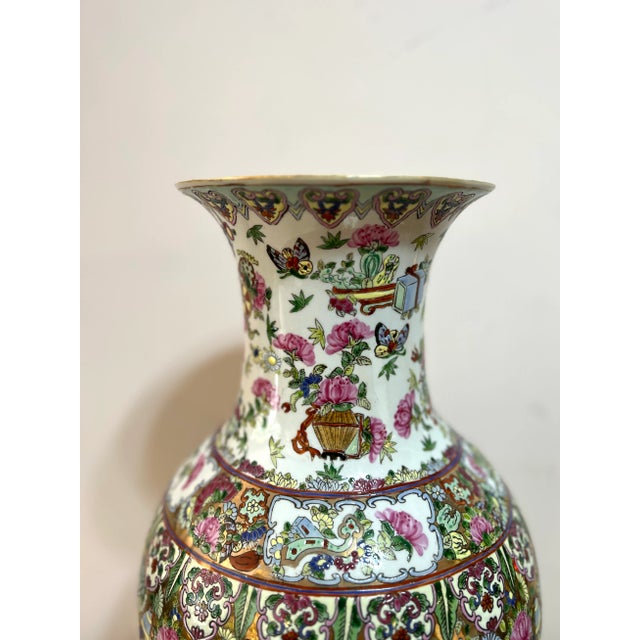 Standing 25” tall, is this beautiful Chinese vase in the famille noir pattern. Hand painted decorated in the Famille Noir...