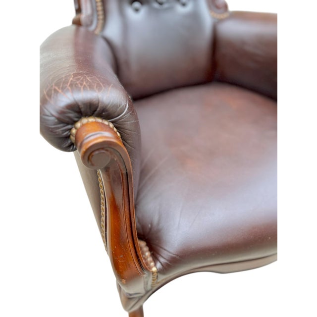 Very comfortable vintage mid century Ralph Lauren inspired chocolate brown leather arm chair. Brass nail head trim and...