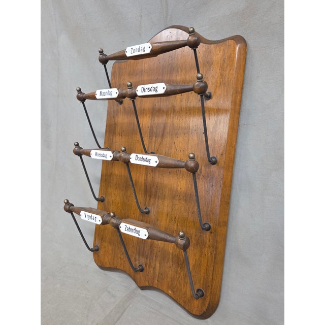 A charming and functional antique 1920s or 1930s wall mounted Dutch organizer for newspapers or magazines labeled with...