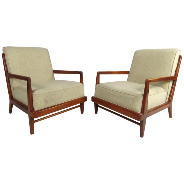 Stylish pair of midcentury Widdicomb lounge chairs. Spacious seating area with large semi-firm cushioning. Handsome...