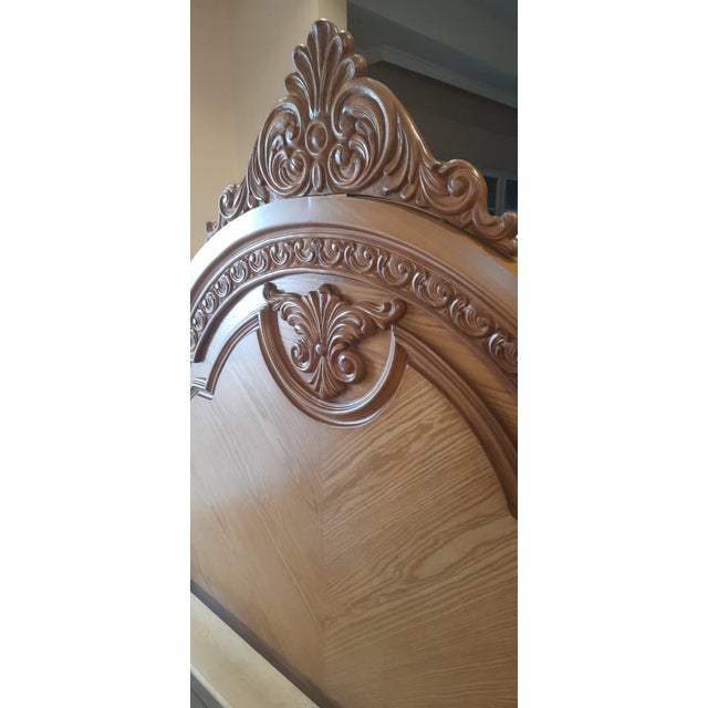 This handcrafted king‑size bed is a statement piece of classic European elegance, featuring an intricately carved...