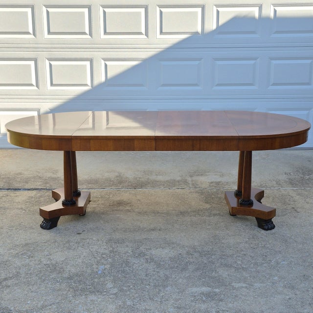 This is a gorgeous oval dining table by high end American furniture maker Baker Furniture Company. The Palladian dining...