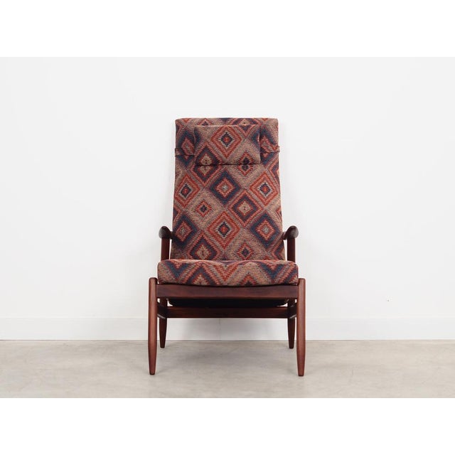 The armchair was made in the 1970s, Danish production. The structure is made of teak wood. The wood has been refreshed....