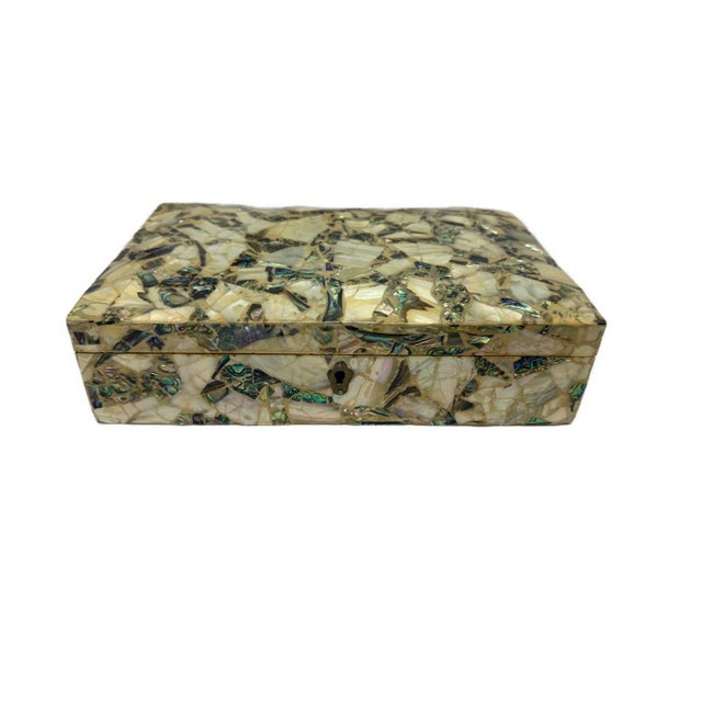This handcrafted jewelry box is made from solid natural wood and fully inlaid by hand with genuine mother of pearl. Each...