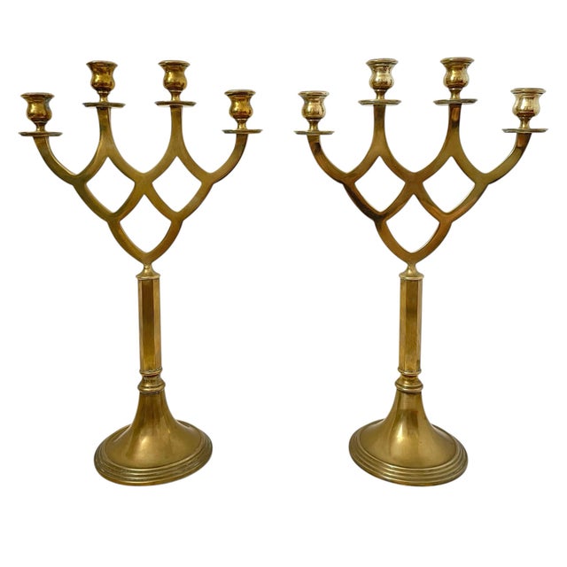 This pair of vintage brass 4 candle candelabras stands at 18" tall, making them a large and impressive addition to any...