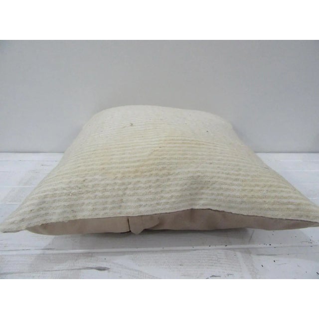 This is a pillow cover made from a vintage kilim rug. The piece was properly washed and ready to use. Pillow inserts not...