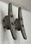 These objects once cast iron boat dock cleats and once commonly used for mooring small crafts have been repurposed as a...