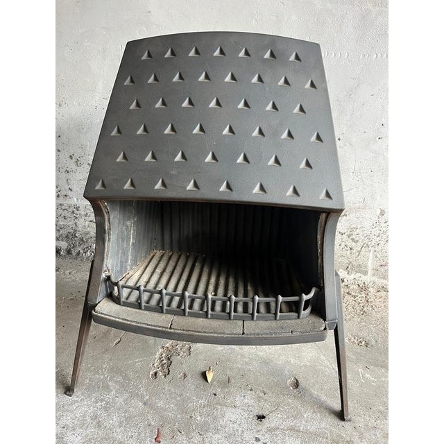 Introduction a sculptural vintage open fireplace stove by morsø, the renowned danish foundry known for its cast-iron...