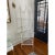 Mid Century Pagoda form faux bamboo etagere in painted metal with four removable glass shelves.