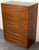 Iconic mid-century tall dresser designed by T.H. Robsjohn-Gibbings for Widdicomb, circa 1950s. Crafted in rich walnut with...
