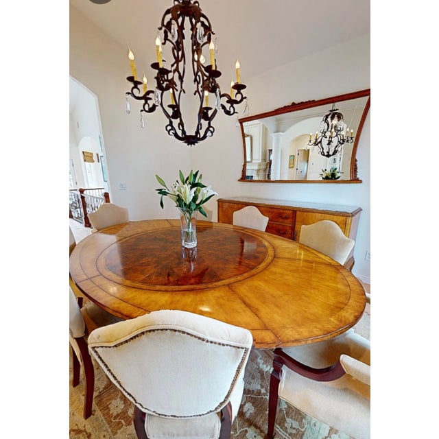 The Jonathan Charles Buckingham Collection Round-to-Oval Expanding Dining Table—the complete dimensions of the table when...