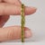 Bring vibrant, sun-drenched green hues to your jewelry collection with this stunning line bracelet. Designed to capture...