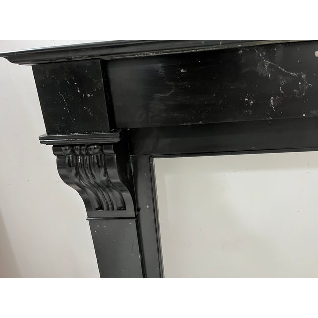 Napoleon iii fireplace in speckled black marble two straight jambs decorated with a corbel featuring recessed fluting good...