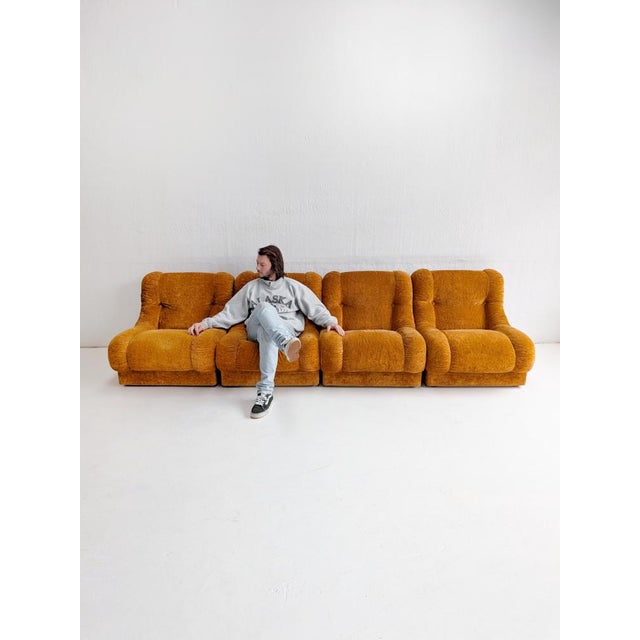 Set of 4 modular lounge chairs from 1970s Italy. Thanks to the wide, bouncy design and soft, orange velvet upholstery,...