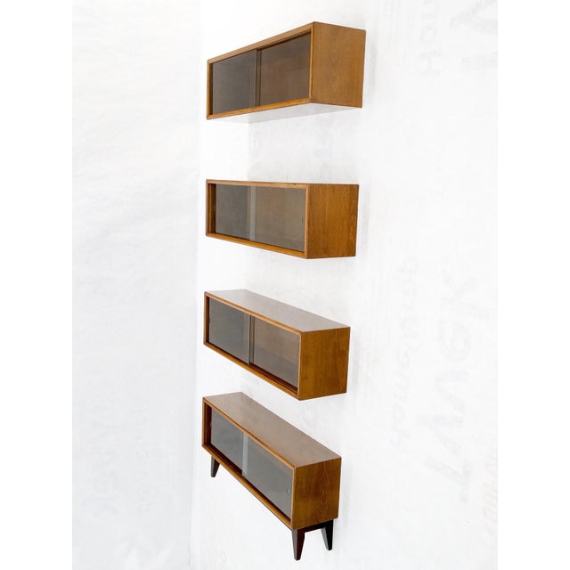 Mid-Century Modern sliding glass doors 4 bays stacking or hanging bookcase. Made in Yugoslavia.