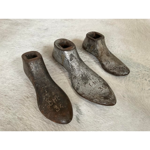 Add a touch of historic, industrial character to your home with these early 20th-century cast iron cobbler’s shoe molds...
