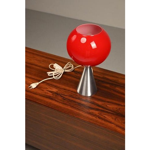 Erco Space Age table lamp from the 70’s made of aluminum and red glass. Refined design from a well known manufacturer....