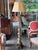 Carved floor lamp in the form of an altar candlestick, the baluster shaft with knopped and faceted sections rising to a...