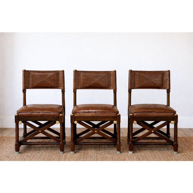 This exceptional set of six Stiles Serengeti campaign chairs exemplifies refined craftsmanship and timeless safari-...