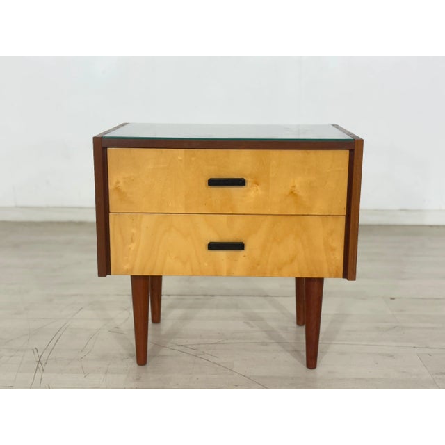 Charming 1960s nightstand available for sale. It's in well-preserved original condition, and features removable glass....