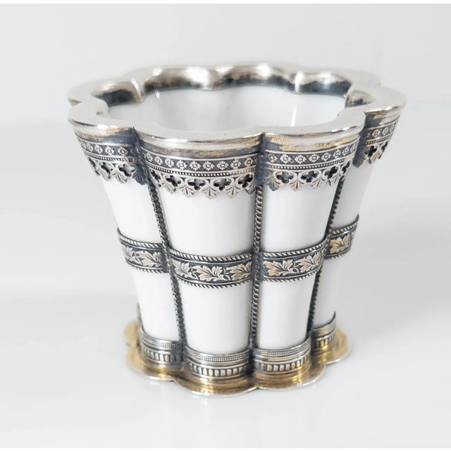 We are selling this attractive Margrethe Cup. This porcelain cup by Royal Copenhagen of Denmark has sterling silver...