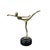 Vintage brass dancer figurine in an arabesque pose, elevated on a marble base.