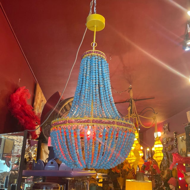 Turquoise color wooden bead, hanging lamp with red accents also in wooden beads in great condition please see photos for...