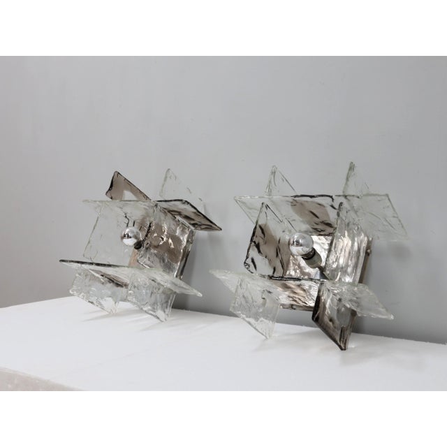 This rare pair of wall or ceiling lights, designed for mazzega in the 1960s, is more than just illumination, it is a...